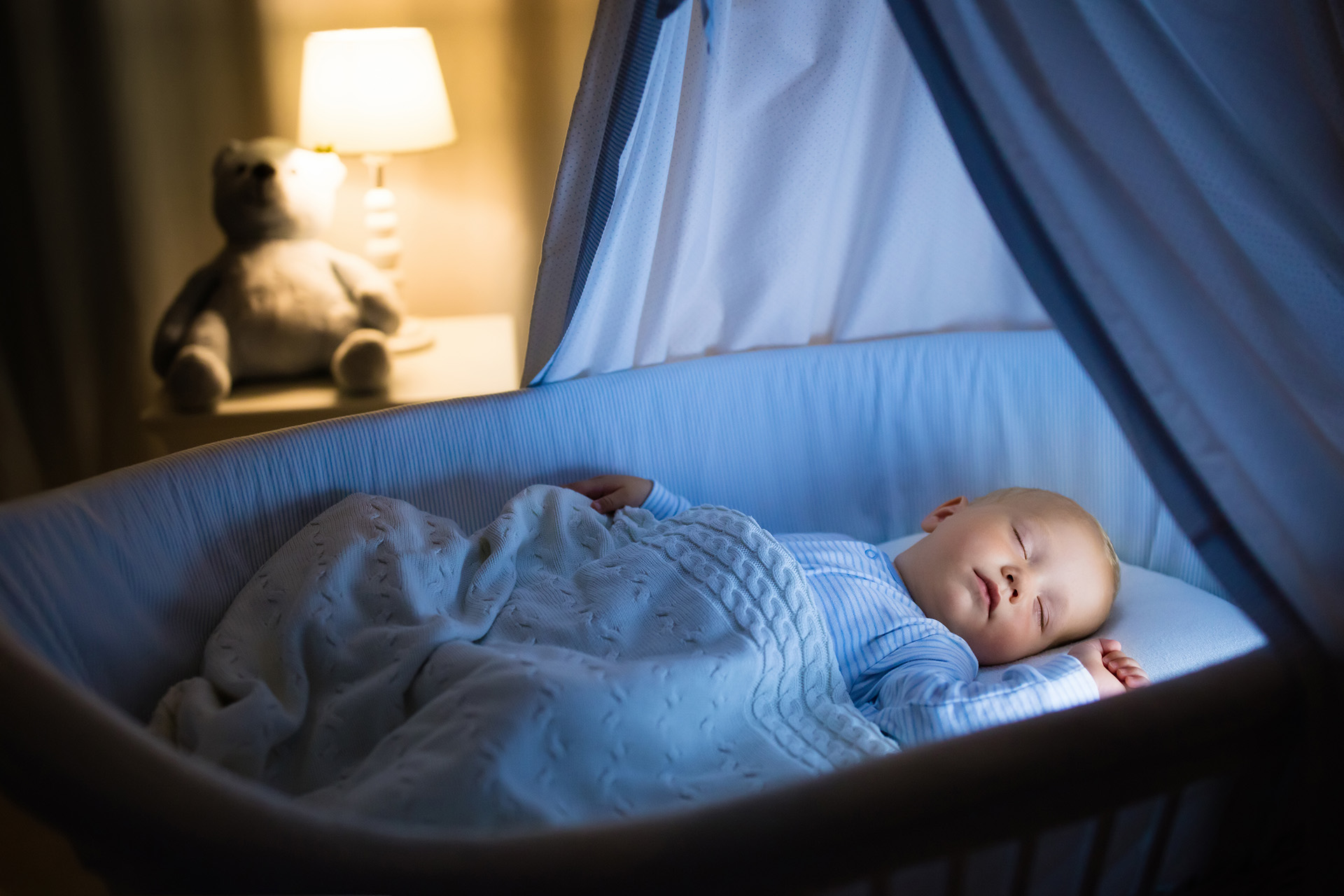 Adorable,Baby,Drinking,Milk,In,Blue,Bassinet,With,Canopy,At
